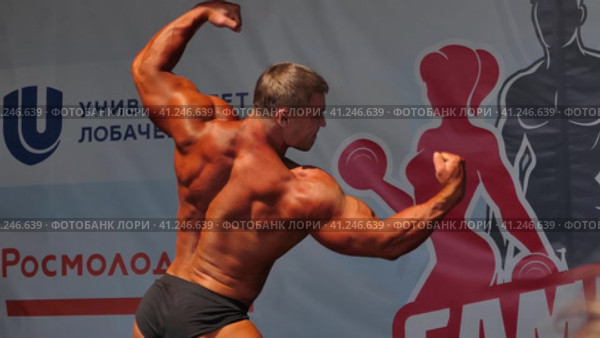 Russia, Nizhny Novgorod, Volzhskaya embankment 21, 05.06.2021. Athletes, men in swimming trunks on stage, bodybuilding performance. Россия, Нижний Новгород, Волжская набережная, 21, 05.06.2021. Спортсмены, мужчины в плавках на сцене, выступление по бодибилдингу. Редакционное видео, видеограф Egor Sarantstv / Фотобанк Лори