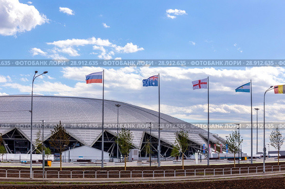 Russia, Samara, June 2018: national flags, countries participating in the World Cup, against the backdrop of the stadium. Стоковое фото, фотограф Акиньшин Владимир / Фотобанк Лори
