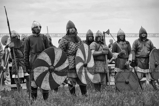 Russia, Staraya Ladoga 23,06,2012 Reenactors with shields and spears during the battle, the festival of historical reconstruction "Pages of History" Стоковое фото, фотограф Анна Кривицкая / Фотобанк Лори