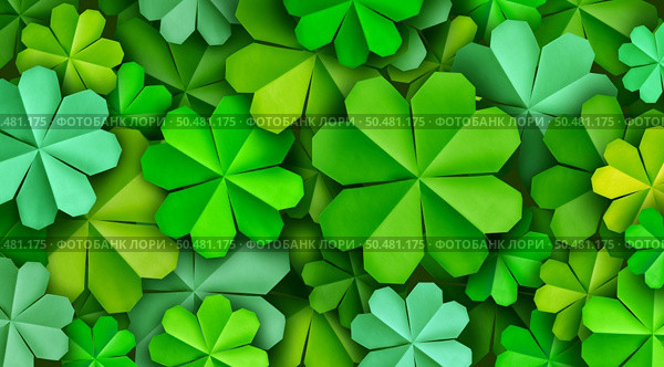 Saint Patrick Decorative Clover St Patricks Day Festive green background as a March celebration of Irish origin as origami clovers as a Holiday graphic element. Стоковое фото, агентство Ingram Publishing / Фотобанк Лори