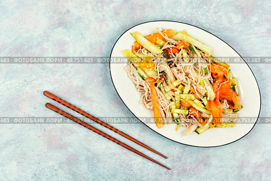 Salad with enoki mushrooms, carrots, cucumber and sesame seeds on a white plate. Menu for Chinese restaurant. Copy space for text.. Chinese salad with enoki mushrooms. Стоковое фото, агентство Ingram Publishing / Фотобанк Лори
