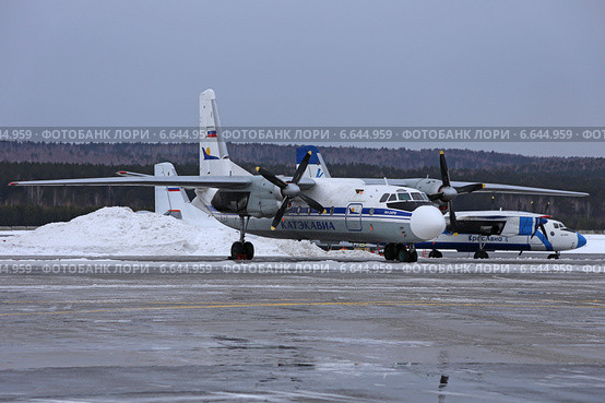 Самолет авиакомпании Катэкавиа Ан-24РВ на стоянке в аэропорту "Емельяново", Красноярск (2013 год). Редакционное фото, фотограф Алексей Гусев / Фотобанк Лори