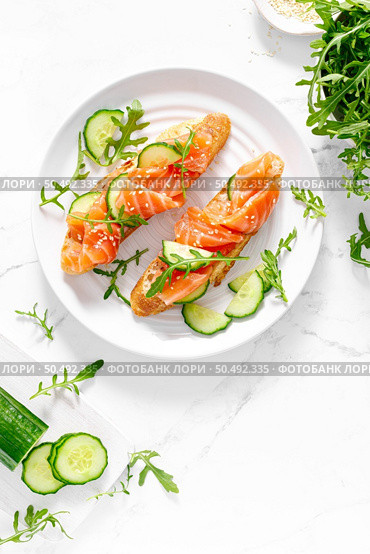 Sandwiches with salted salmon. Healthy food, breakfast. Top view. Стоковое фото, агентство Ingram Publishing / Фотобанк Лори