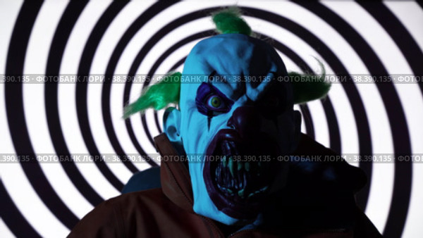 Scary man with Clown mask against rotating black spiral background. Стоковое видео, видеограф Mihail Mihaylov / Фотобанк Лори