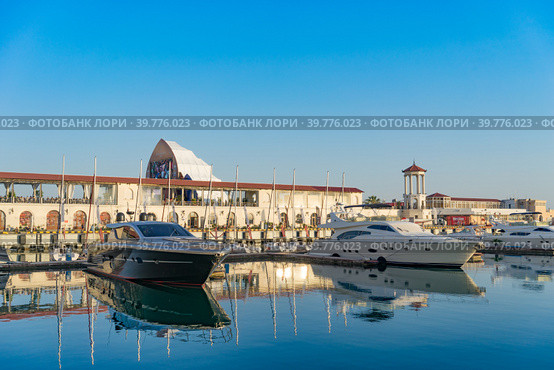 Sea port with yacht Parking on the background of the multimedia screen fanzone FIFA -2018. Редакционное фото, фотограф Виктория Кольцова / Фотобанк Лори
