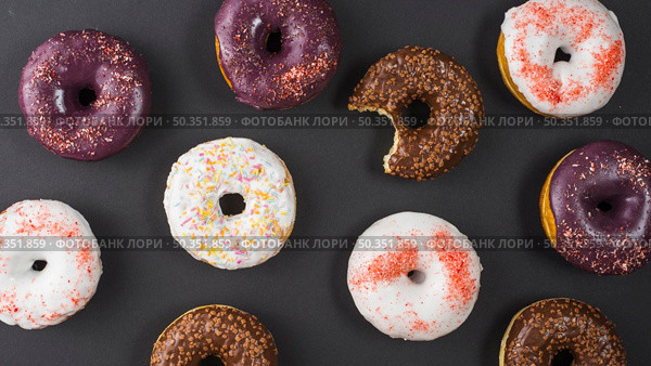 set delicious sweet bitten donuts with colorful coating. Стоковое фото, агентство Ingram Publishing / Фотобанк Лори