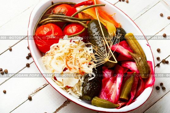 Set of pickles from tomato, sauerkraut, okra, cucumbers and cowpea. Pickles. Tasty homemade pickles, preserved. Стоковое фото, агентство Ingram Publishing / Фотобанк Лори