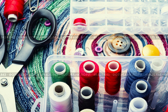 Sewing accessories of buttons, threads and needles. Needlework set. Large sewing kit. Стоковое фото, агентство Ingram Publishing / Фотобанк Лори