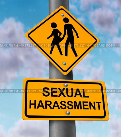 Sexual harassment and sex abuse with a yellow street or highway sign on a blue sky with a woman victim and a man bullying icon in the process of a physical assault at the workplace or in private. Стоковое фото, агентство Ingram Publishing / Фотобанк Лори