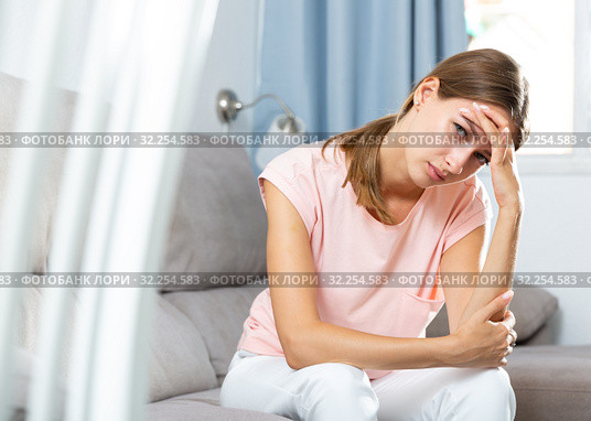 Sick female holding hands on her head. Стоковое фото, фотограф Яков Филимонов / Фотобанк Лори