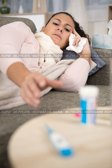 sick woman cup of tea pills and mixture. Стоковое фото, агентство Ingram Publishing / Фотобанк Лори