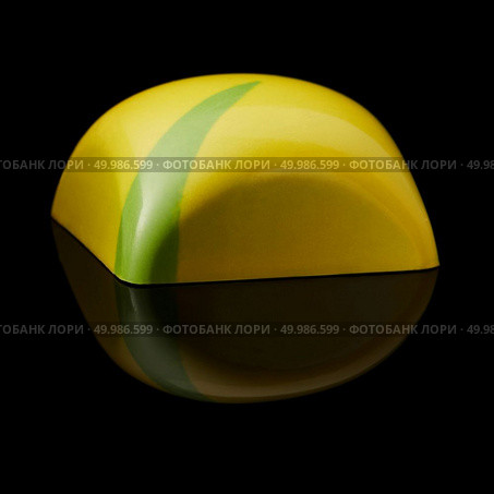 Sideways yellow chocolate candy on a black background. chocolate candy on black background. Стоковое фото, агентство Ingram Publishing / Фотобанк Лори