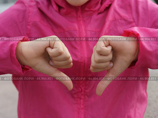 Sign language. Thumb down. Стоковое фото, фотограф YuryKara / Фотобанк Лори