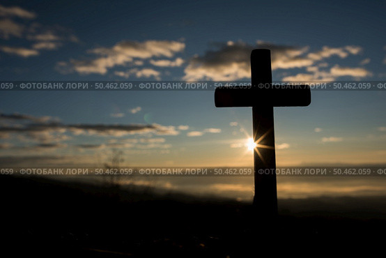 Silhouette of catholic cross and sunrise. Стоковое фото, агентство Ingram Publishing / Фотобанк Лори