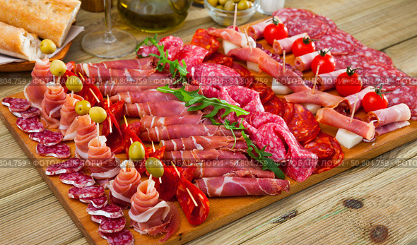 Slices of Spanish gammon, sausages, bacon. Стоковое фото, фотограф Яков Филимонов / Фотобанк Лори