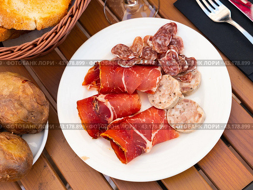 Slicing of smoked white sausages, ham and pieces whip. Стоковое фото, фотограф Яков Филимонов / Фотобанк Лори
