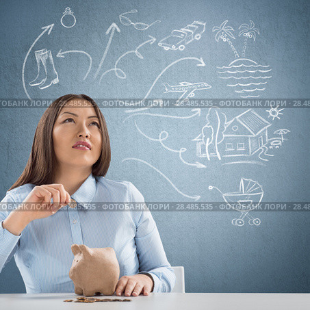 Smart business woman thinking. Sketches with her toughts overhead. Стоковое фото, фотограф Kirill Kedrinskiy / Ingram Publishing / Фотобанк Лори
