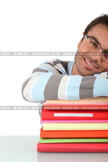 Smiling man with a stack of files. Стоковое фото, агентство Ingram Publishing / Фотобанк Лори