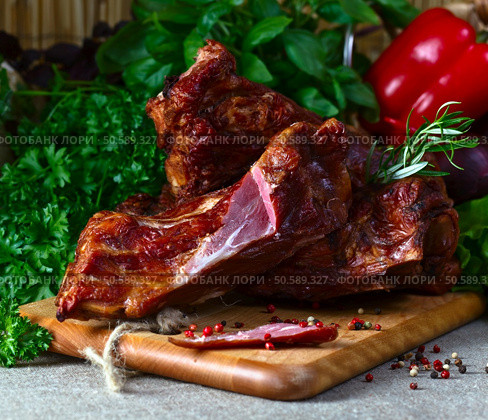 smoked meat , vegetables and greens  on a kitchen table. Стоковое фото, агентство Ingram Publishing / Фотобанк Лори