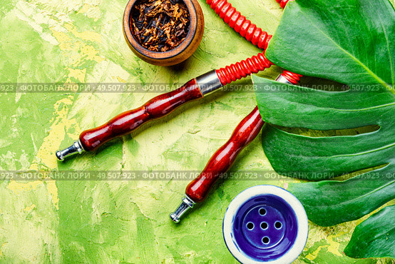 Smoking hookah.Details of Turkish hooka.Shisha with a fruity aroma of tobacco.. Oriental smoking hookah. Стоковое фото, агентство Ingram Publishing / Фотобанк Лори