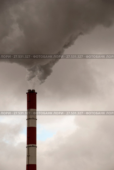 Smoking pipe of thermal power plant against gray sky, little clearing in the clouds. Стоковое фото, фотограф Дмитрий Рыженков / Фотобанк Лори