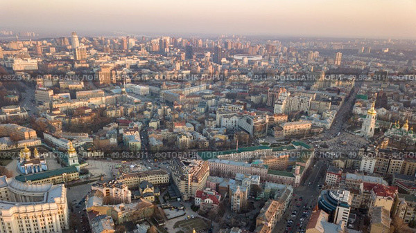 Sofievskaya Tower and the square, St. Michael’s Cathedral, the city center, Vladimirsky Proyezd and the Olympic stadium in the distance in Kyiv, Ukraine. Photo by drone. Sophia Tower and square, city center and Olympic Stadium in the city of Kiev. Стоковое фото, агентство Ingram Publishing / Фотобанк Лори