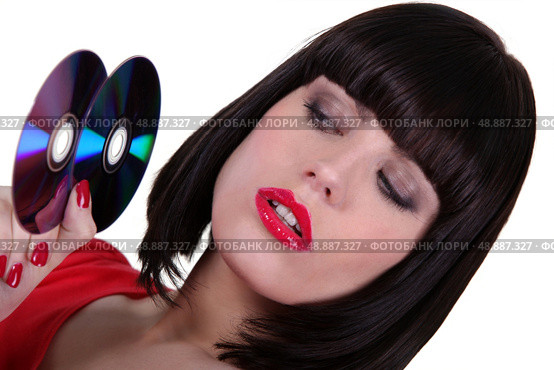 sophisticated brunette with cds. Стоковое фото, агентство Ingram Publishing / Фотобанк Лори