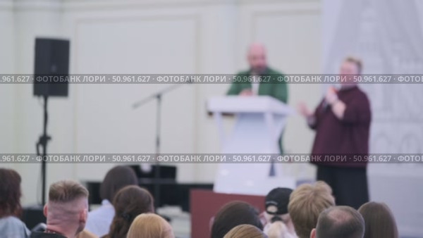 Speaker delivering lecture at business seminar with audience attention. Стоковое видео, видеограф Антон Гвоздиков / Фотобанк Лори