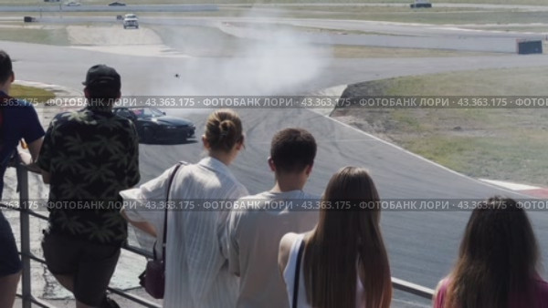 Sports drift cars burn rubber in turns in front of the audience on the ADM Racing track in Myachkovo. Russia. Moscow. 29.05.2024. Редакционное видео, видеограф Ярославский Максим / Фотобанк Лори