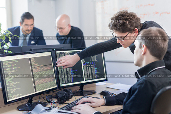 Startup business problem solving. Software developers working on desktop computer. Стоковое фото, фотограф Matej Kastelic / Фотобанк Лори