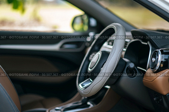 steering wheel in the car, selective focus. Стоковое фото, агентство Ingram Publishing / Фотобанк Лори
