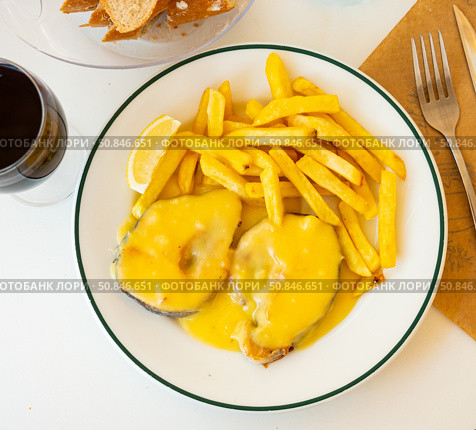 Stewed hake Merluza en salsa holandesa with potatoes. Стоковое фото, фотограф Яков Филимонов / Фотобанк Лори