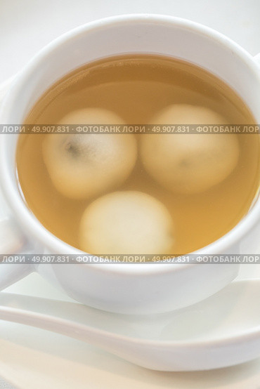 Sticky rice pearls stuff with blacksesame in ginger soup. Стоковое фото, агентство Ingram Publishing / Фотобанк Лори