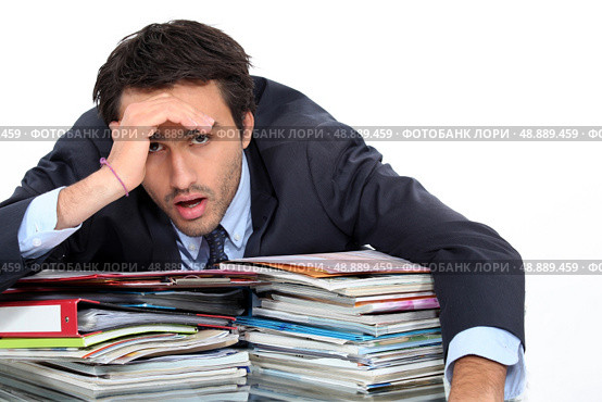 Stressed man under lots of pressure at work. Стоковое фото, агентство Ingram Publishing / Фотобанк Лори