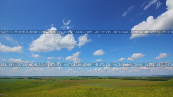 Summer landscape with cloudy sky, view from hill, timelapse, 4k. Стоковое видео, видеограф Михаил Коханчиков / Фотобанк Лори