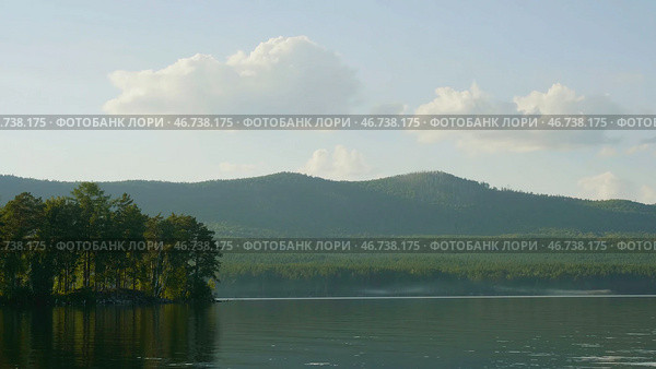 Summer landscape with river, cloudy sky, forest and sun timelapse. Стоковое фото, фотограф David Kashakhi / Фотобанк Лори