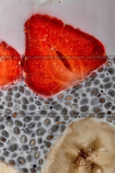 Superfoods breakfast with Chia seed pudding and berries and banana in a glass. Health concept, omega 3 product. Close up. chia seeds pudding with strawberries and bananas puree in glass jar, macro shot. Стоковое фото, агентство Ingram Publishing / Фотобанк Лори