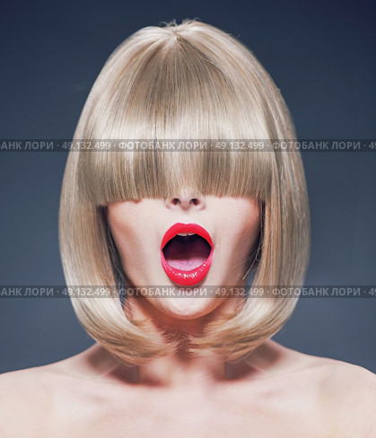 Surprised young lady with a long fringe. Стоковое фото, агентство Ingram Publishing / Фотобанк Лори