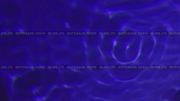 Swirling blue liquid creating concentric circles. Стоковая иллюстрация, иллюстратор David Kashakhi / Фотобанк Лори