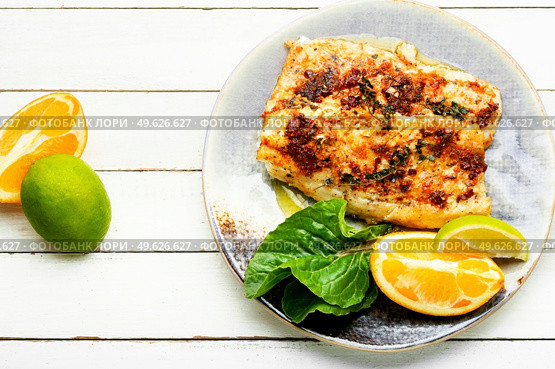 Tasty baked fish, fried pike perch in orange sauce.. Roasted fish fillets. Стоковое фото, агентство Ingram Publishing / Фотобанк Лори