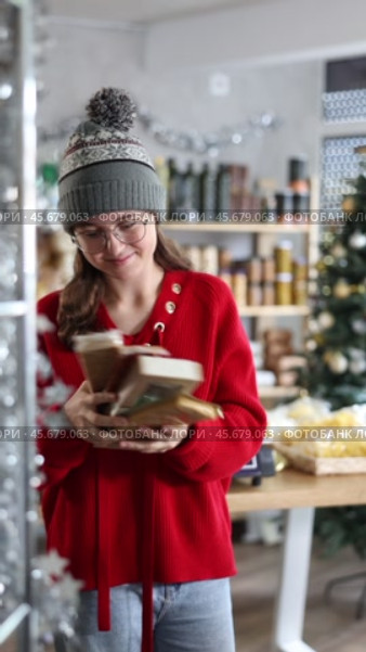 Teen girl selects suitable product from nougat assortment. Стоковое видео, видеограф Яков Филимонов / Фотобанк Лори