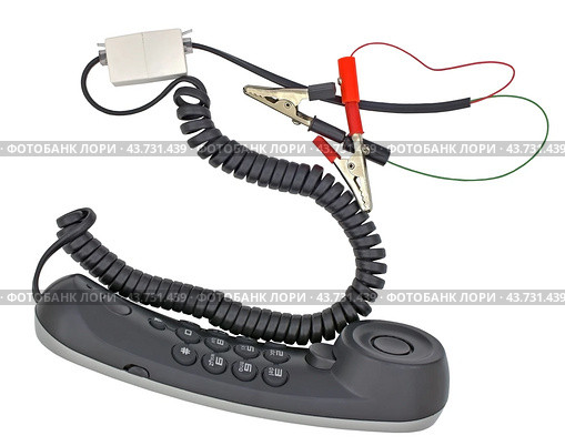 Телефонная трубка с зажимами на белом фоне. Telephone handset with clips on white background. Стоковое фото, фотограф Татьяна Д / Фотобанк Лори