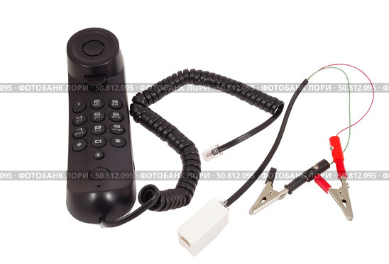 Телефонная трубка с зажимами на белом фоне. Telephone handset with clips on white background. Стоковое фото, фотограф Татьяна Д / Фотобанк Лори