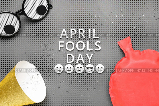 Text APRIL FOOLS DAY, funny decor and party hat on board. Стоковое фото, фотограф Pixel_shot / Фотобанк Лори
