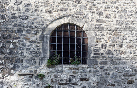 The background old beige stony wall with a window. Стоковое фото, фотограф Татьяна Ляпи / Фотобанк Лори
