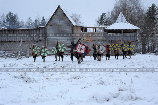 The festival is a historical reconstruction of the Viking Age in winter. Vikings attack with shields and helmets (2014 год). Редакционное фото, фотограф Анна Кривицкая / Фотобанк Лори