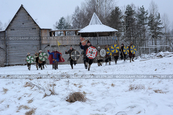 The festival is a historical reconstruction of the Viking Age in winter. Vikings attack with shields and helmets (2014 год). Редакционное фото, фотограф Анна Кривицкая / Фотобанк Лори