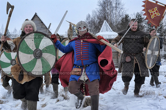 The festival is a historical reconstruction of the Viking Age in winter. Vikings attack with shields and helmets (2014 год). Редакционное фото, фотограф Анна Кривицкая / Фотобанк Лори