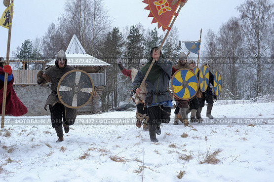 The festival is a historical reconstruction of the Viking Age in winter. Vikings attack with shields and helmets (2014 год). Редакционное фото, фотограф Анна Кривицкая / Фотобанк Лори