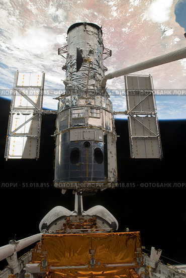 The Hubble Space Telescope is released from the cargo bay of Space Shuttle Atlantis. Стоковое фото, фотограф Stocktrek Images, Inc. / ТАСС / Фотобанк Лори